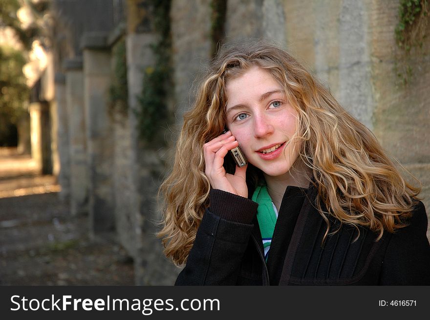 Candid portrait of teenager talking on mobile phone. Candid portrait of teenager talking on mobile phone