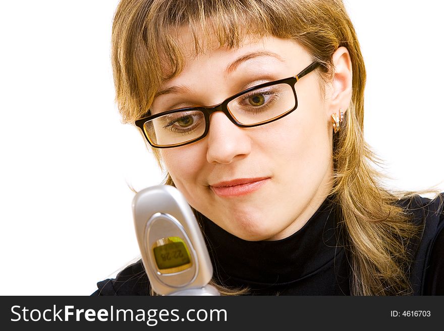 Girl in glasses looking at the phone. Girl in glasses looking at the phone