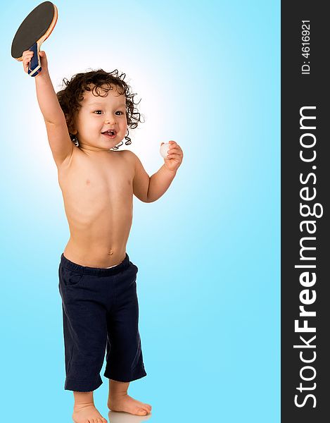 The child plays table tennis, on blue background. The child plays table tennis, on blue background.