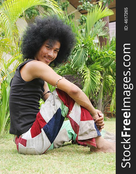 Thai man with a big afro hairstyle.