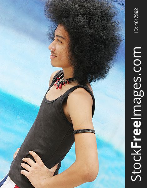 Thai man with a big afro hairstyle isolated on white.