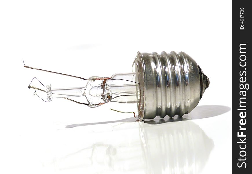 The burned-out light bulb on a white background. The burned-out light bulb on a white background.