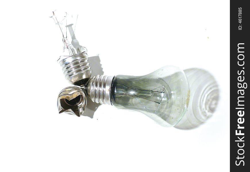 The burned-out light bulb on a white background. The burned-out light bulb on a white background.