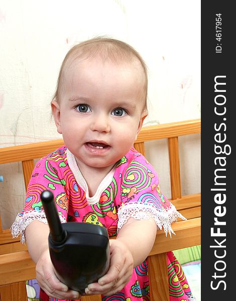 Lovely baby girl in pink dress with phone. Lovely baby girl in pink dress with phone