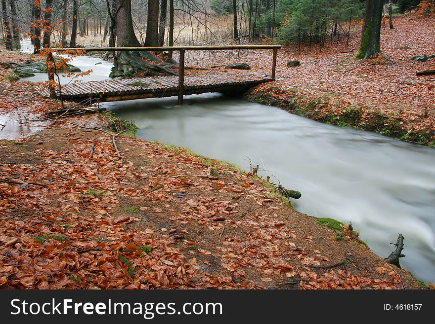 Foot bridge across the stream. Foot bridge across the stream