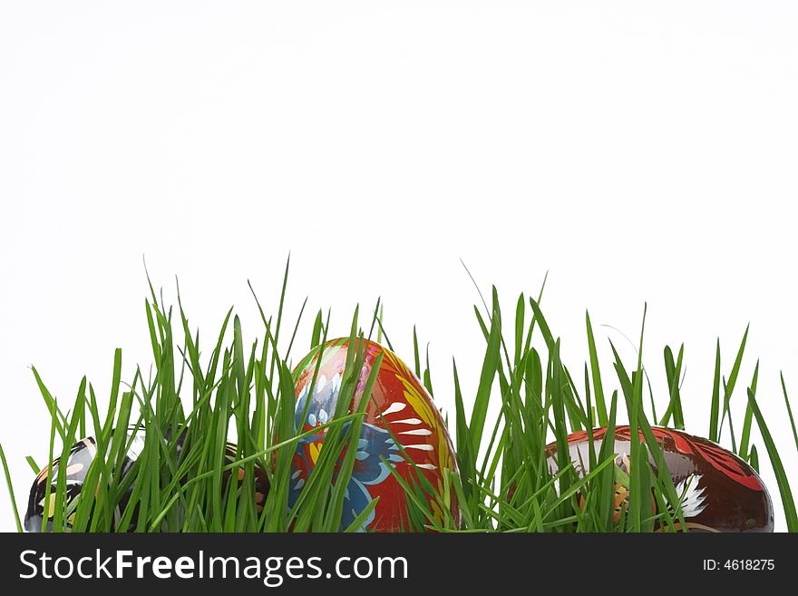 easter eggs in grass isolated on white background