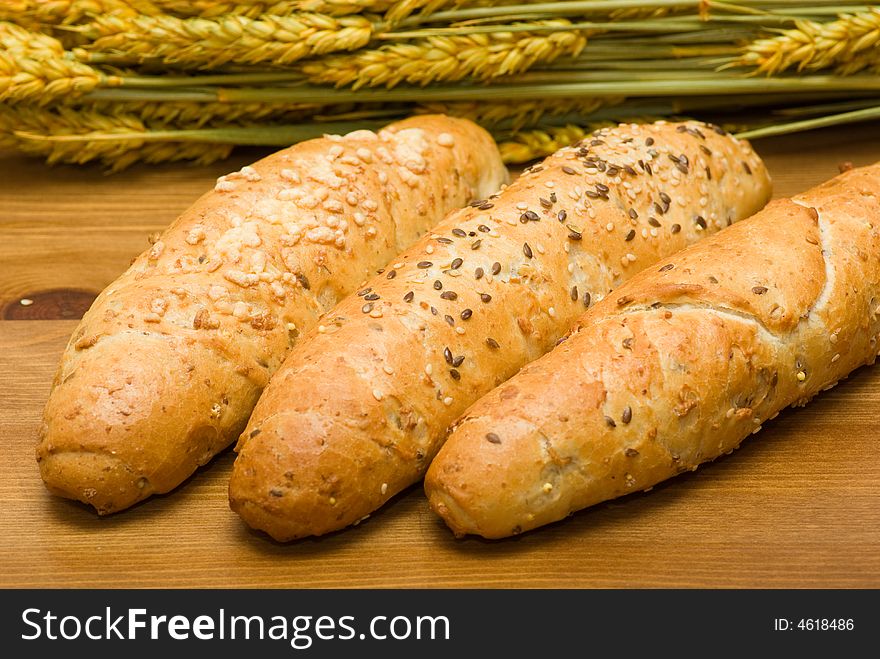 Three bread roll in flat basket and crop