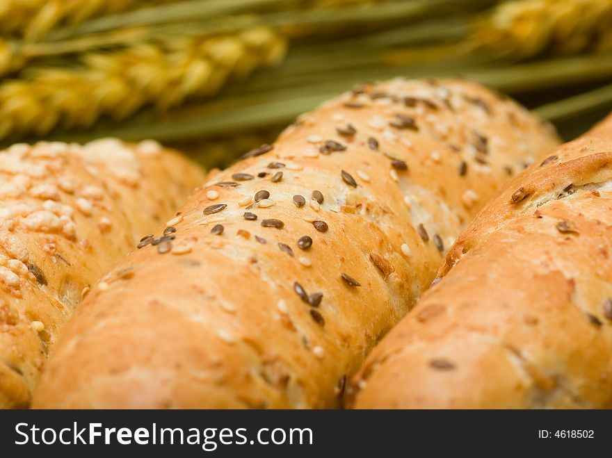 Three bread roll in flat basket and crop