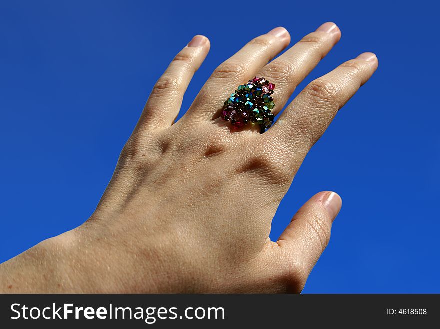 An image of a woman's hand with a handmade ring. An image of a woman's hand with a handmade ring