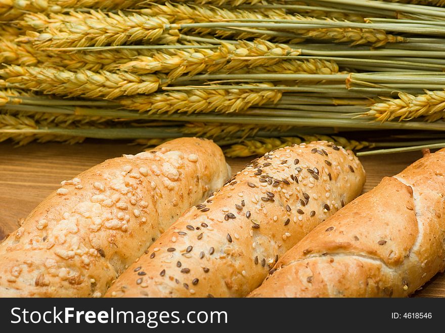 Three bread roll in flat basket and crop