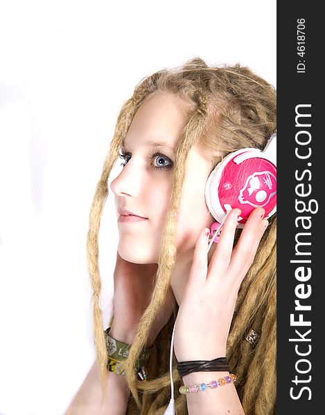 A beautiful blond girl listening to music. A beautiful blond girl listening to music