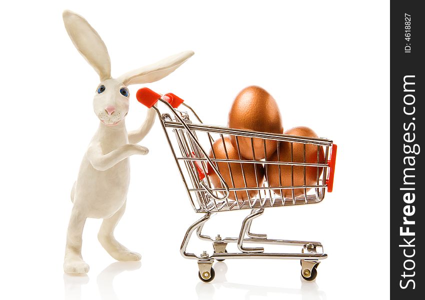 Easter rabbit carries the cart with gold eggs. Easter rabbit carries the cart with gold eggs