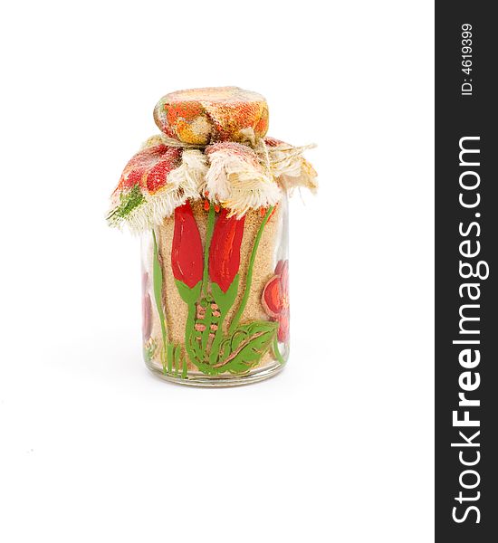 Small colourful pepper jar with cloth cover isolated on white