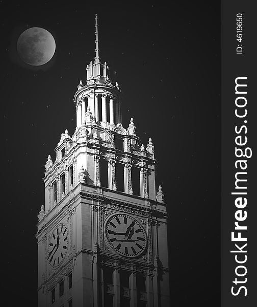 Moonlight illuminating an old city clock tower. Moonlight illuminating an old city clock tower.