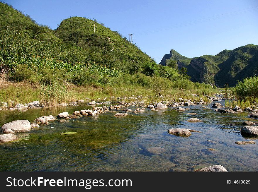 A limpid river running through the mountains. A limpid river running through the mountains