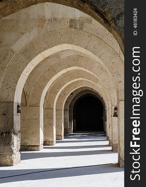 Multiple arches and columns in Sultanhani caravansary on Silk Road, Turkey