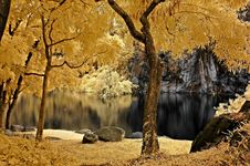Infrared Photo – Lake, Rock, Reflection And Tree Stock Photo