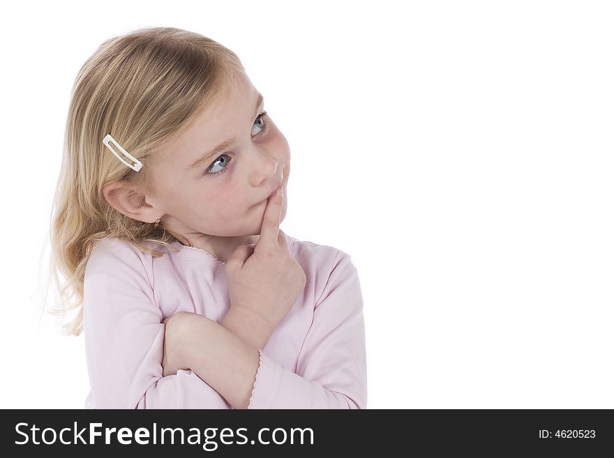 Cute girl dressed in pink shirt, thinking