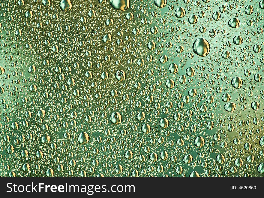 Water drops on the green-orange background