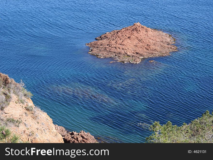 Red rock and blue sea for the Mediterranean coast in French Riviera. Red rock and blue sea for the Mediterranean coast in French Riviera