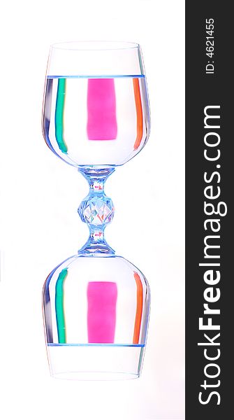 Coloured varicoloured wineglasses with reflections
