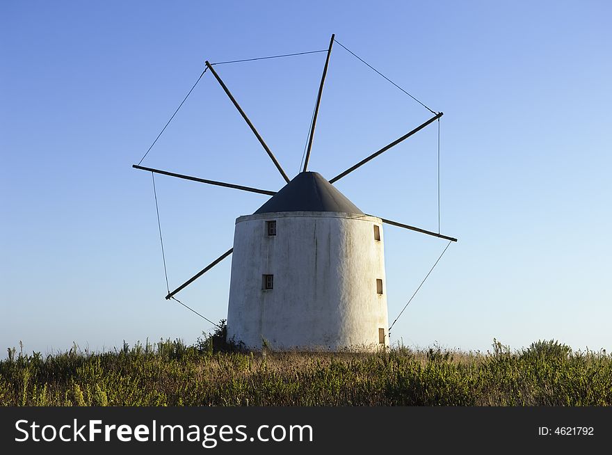 Old windmill in the top of a hill, Portugal