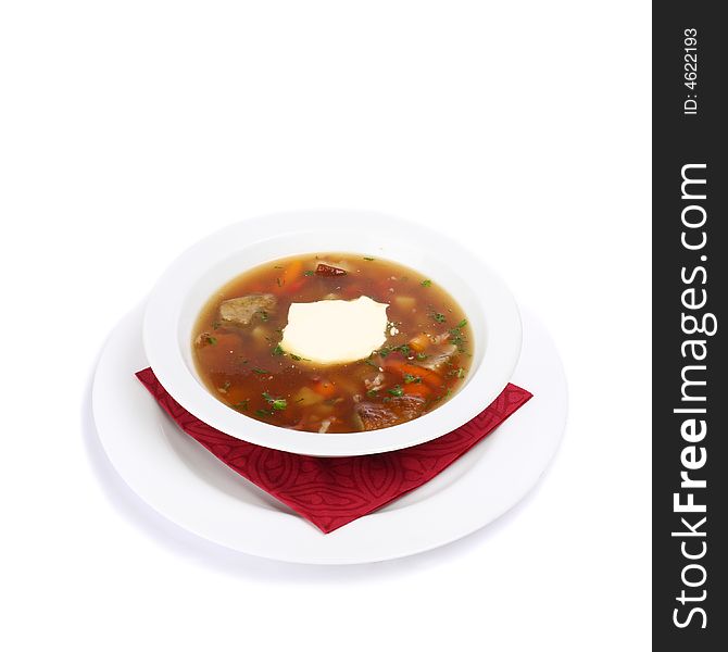 A plate of solyanka soup on white background