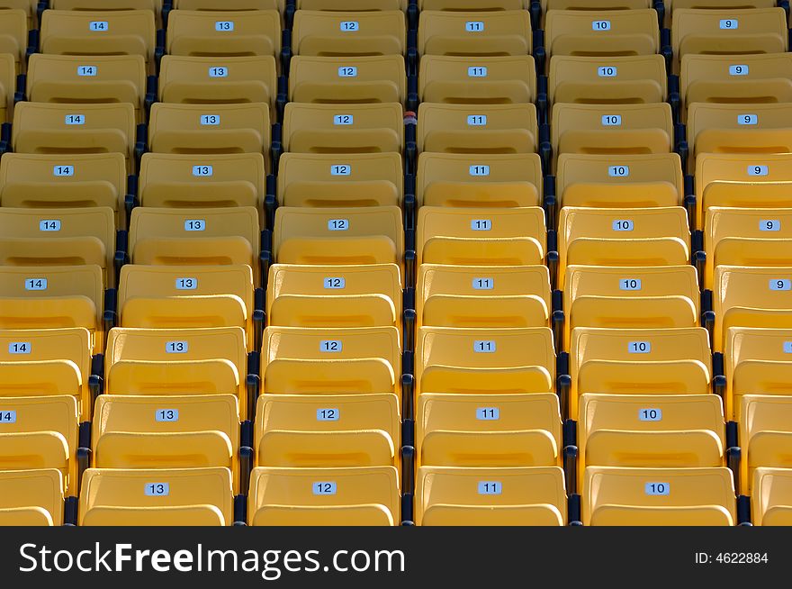 Empty Yellow Numbered Stadium Seating