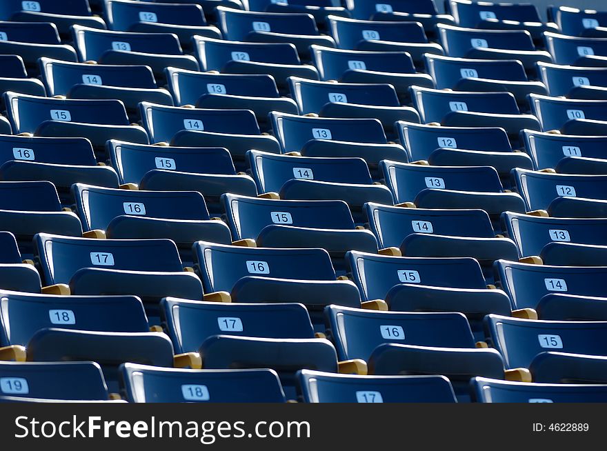 Empty Blue Numbered Stadium Seating
