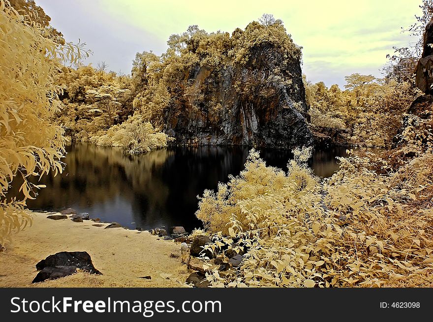 Infrared photo â€“ lake, rock, reflection and tree in the parks