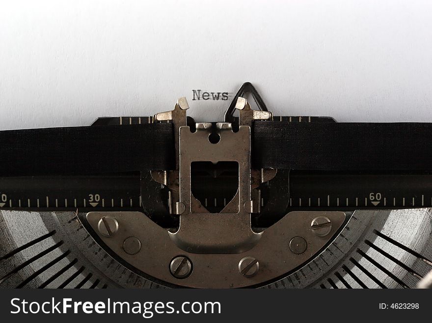 Typewriter typing news close up