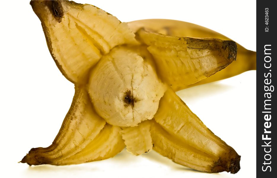 Isolated opened banana on white background with shadow. Isolated opened banana on white background with shadow