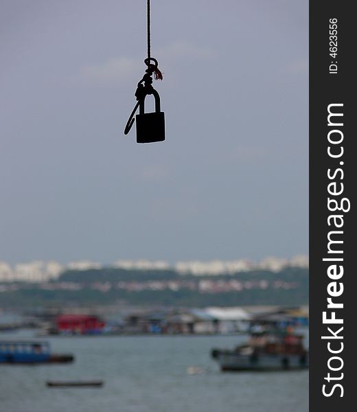 Lock hanging from tree.  Looks like you need a key to enter into the travel world. Lock hanging from tree.  Looks like you need a key to enter into the travel world.