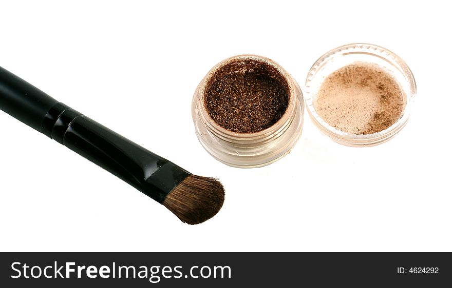 Loose eye shadow with brush on a white background