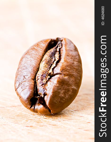 Coffee bean on a wooden surface. Coffee bean on a wooden surface