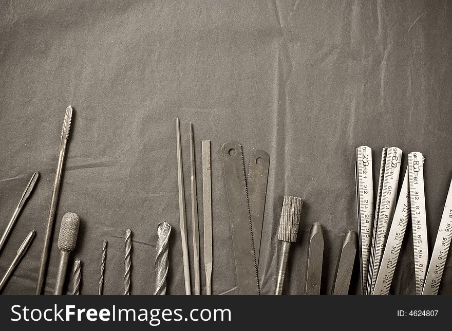 Old tools on black background