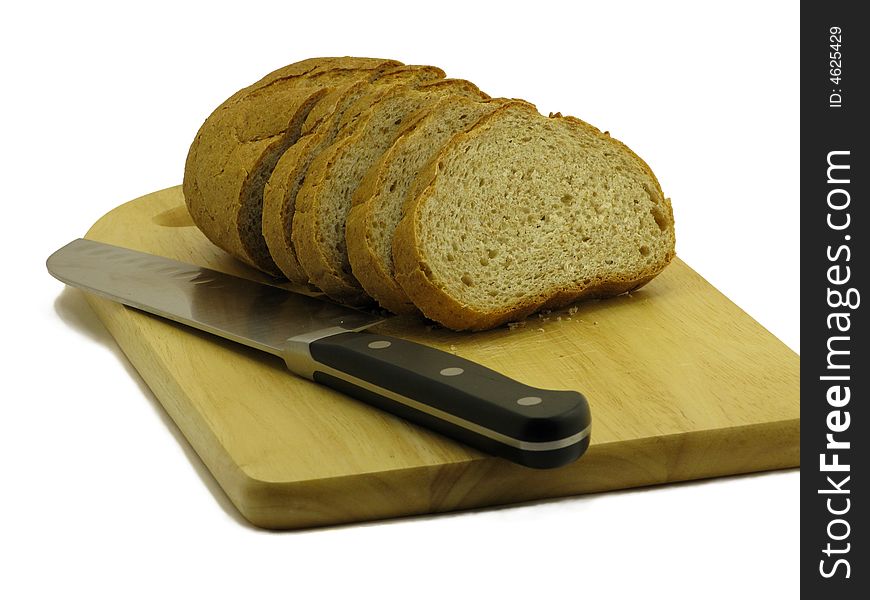 Bread and knife on cutting board