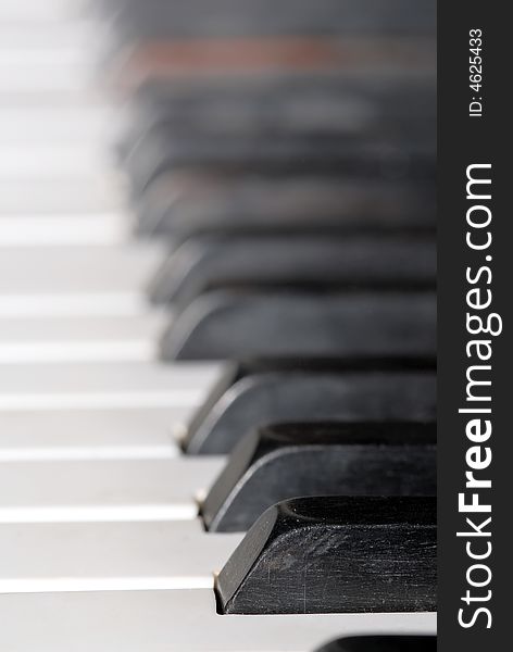 Close-up of piano keyboards, focus on first one key