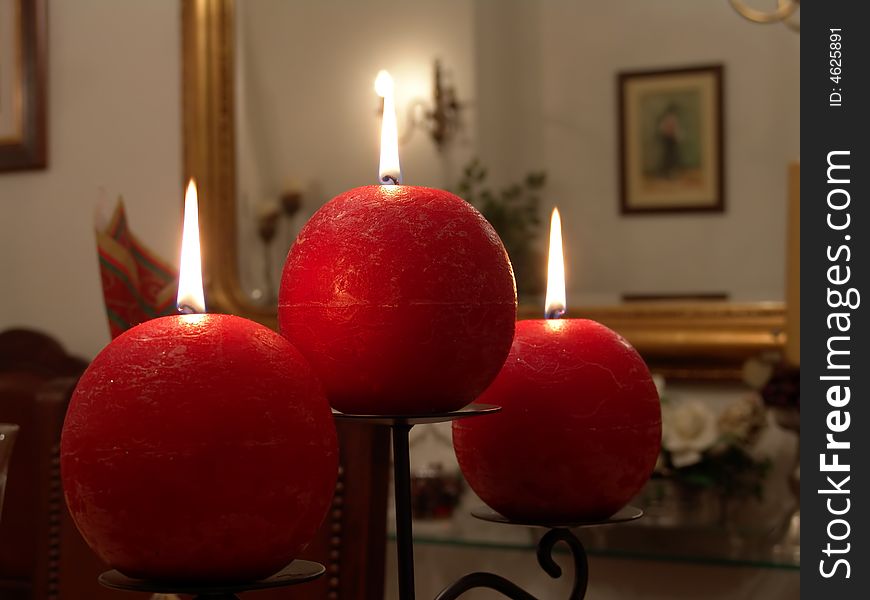 Christmas candle decoration on the table inside a house