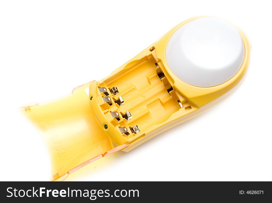 Yellow battery charger over white isolated background