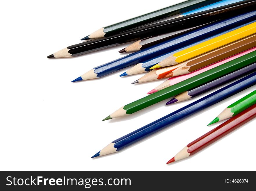 Multicolored pencils on the whie isolated background