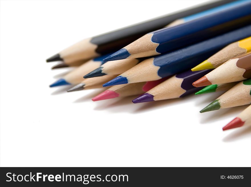 Multicolored pencils on the whie isolated background