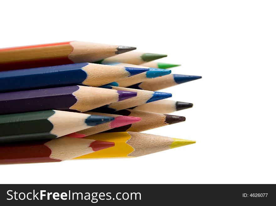 Multicolored pencils on the whie isolated background