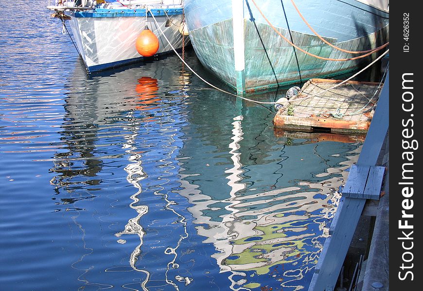 Beautiful and colorful reflection of boats in the water. Beautiful and colorful reflection of boats in the water