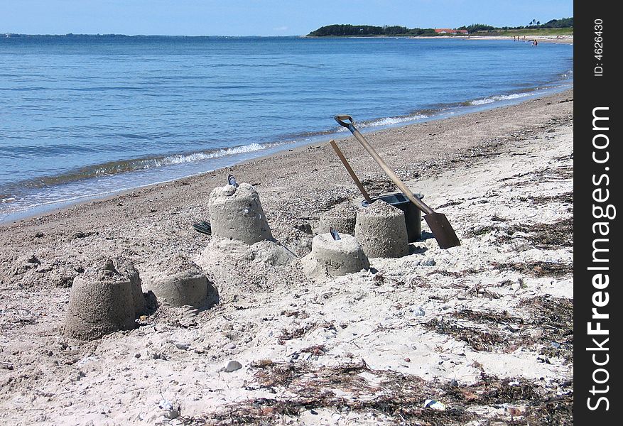 Beach fun - building castles from sea sand. Beach fun - building castles from sea sand