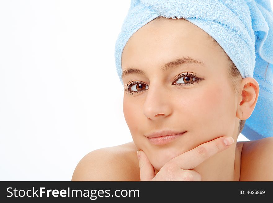 Spa woman in blue towel on white background