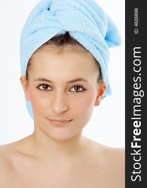 Spa woman in blue towel on white background