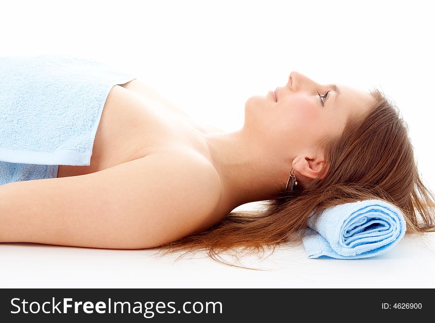 Spa woman in blue towel on white background