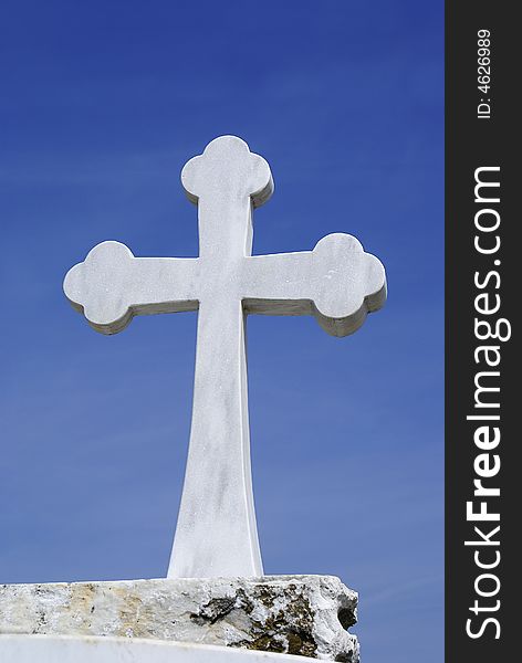 A photo of Cross with white marble