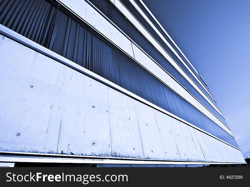 Abstract view of corporate building agaisnt blue sky.